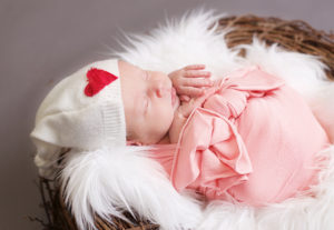 Baby girl with a Valentines Day Hat, Maine newborn Photographer 