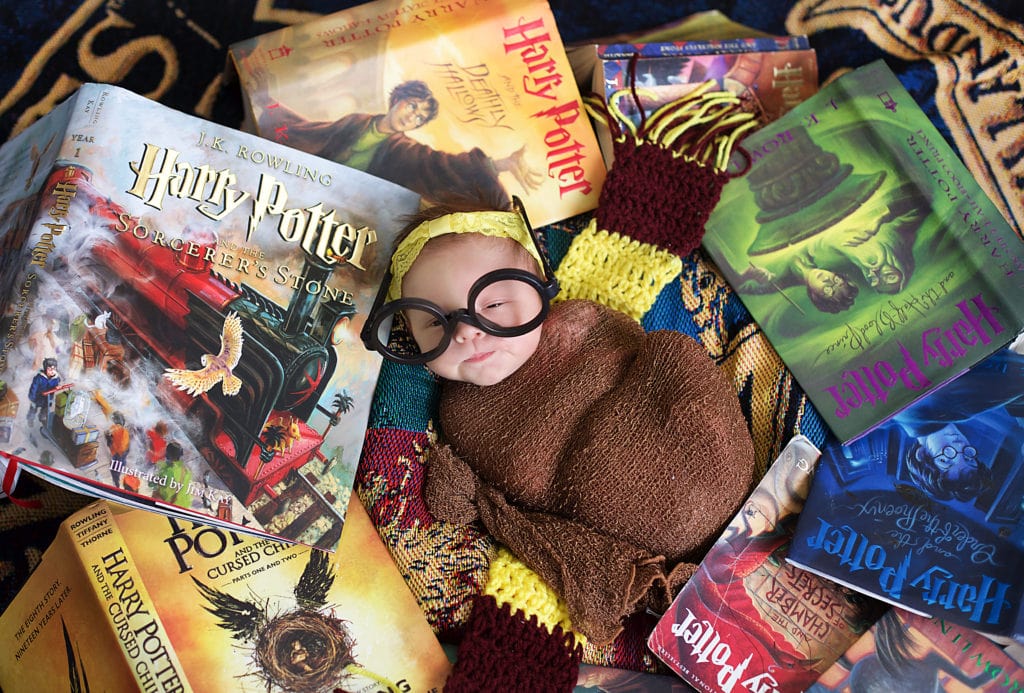 Harry Potter fans, baby girl in Harry Potter books with wizard glasses