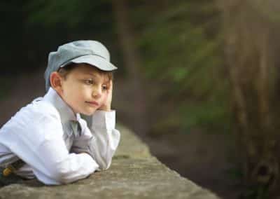 young boy looking over bridge in Maine