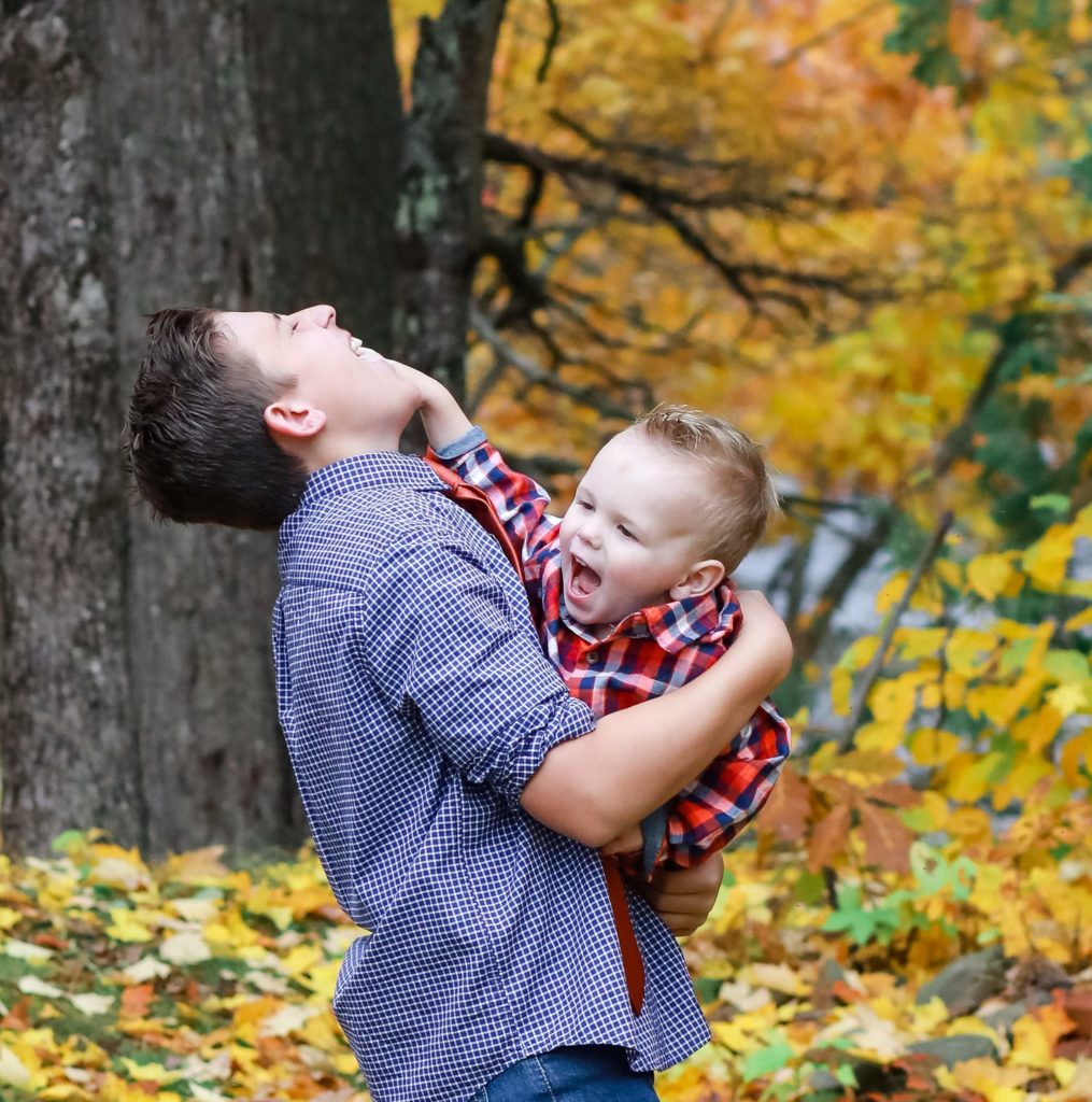 brothers playing the fall wearing plaid