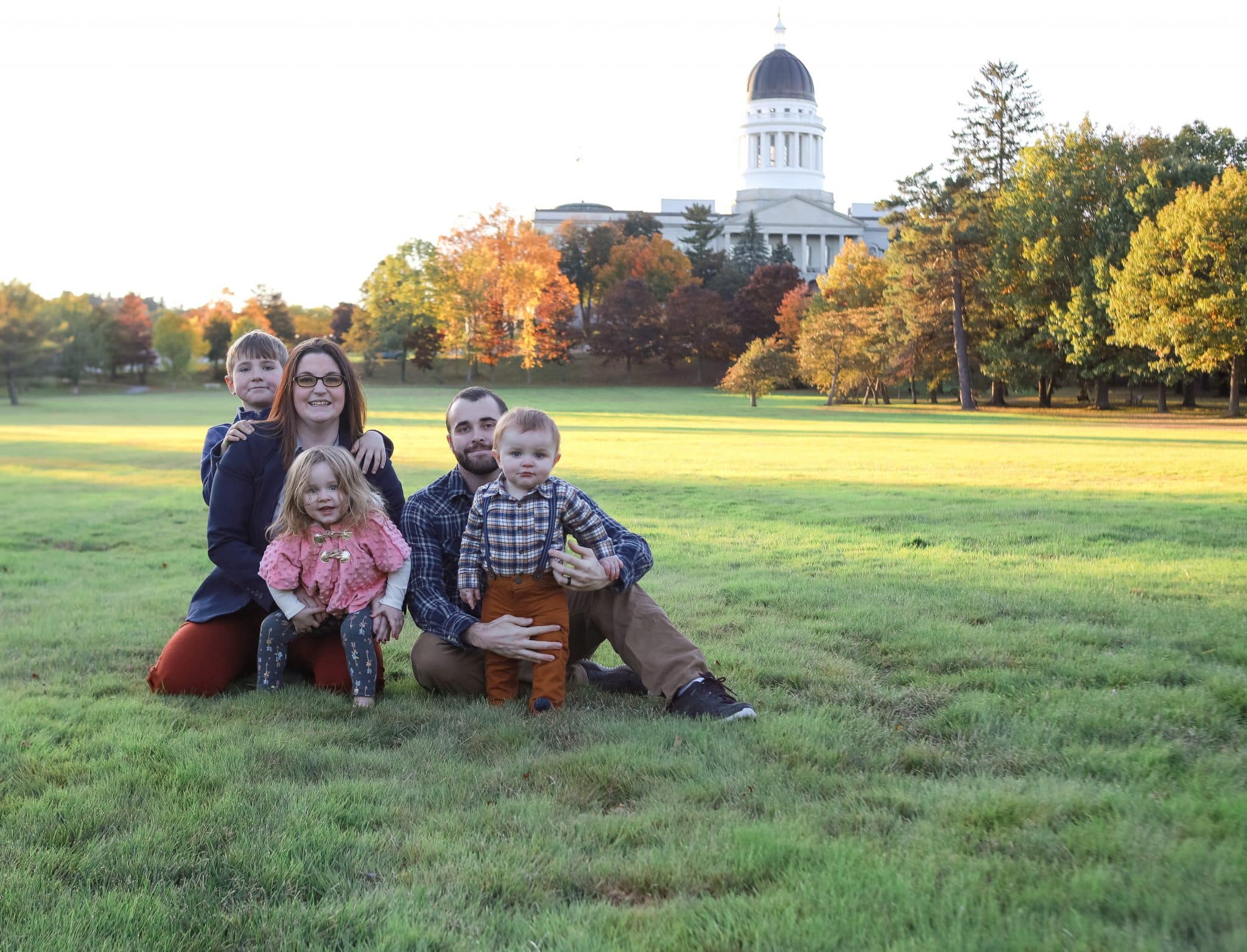 family photo in front of the state capitol in augusta,maine