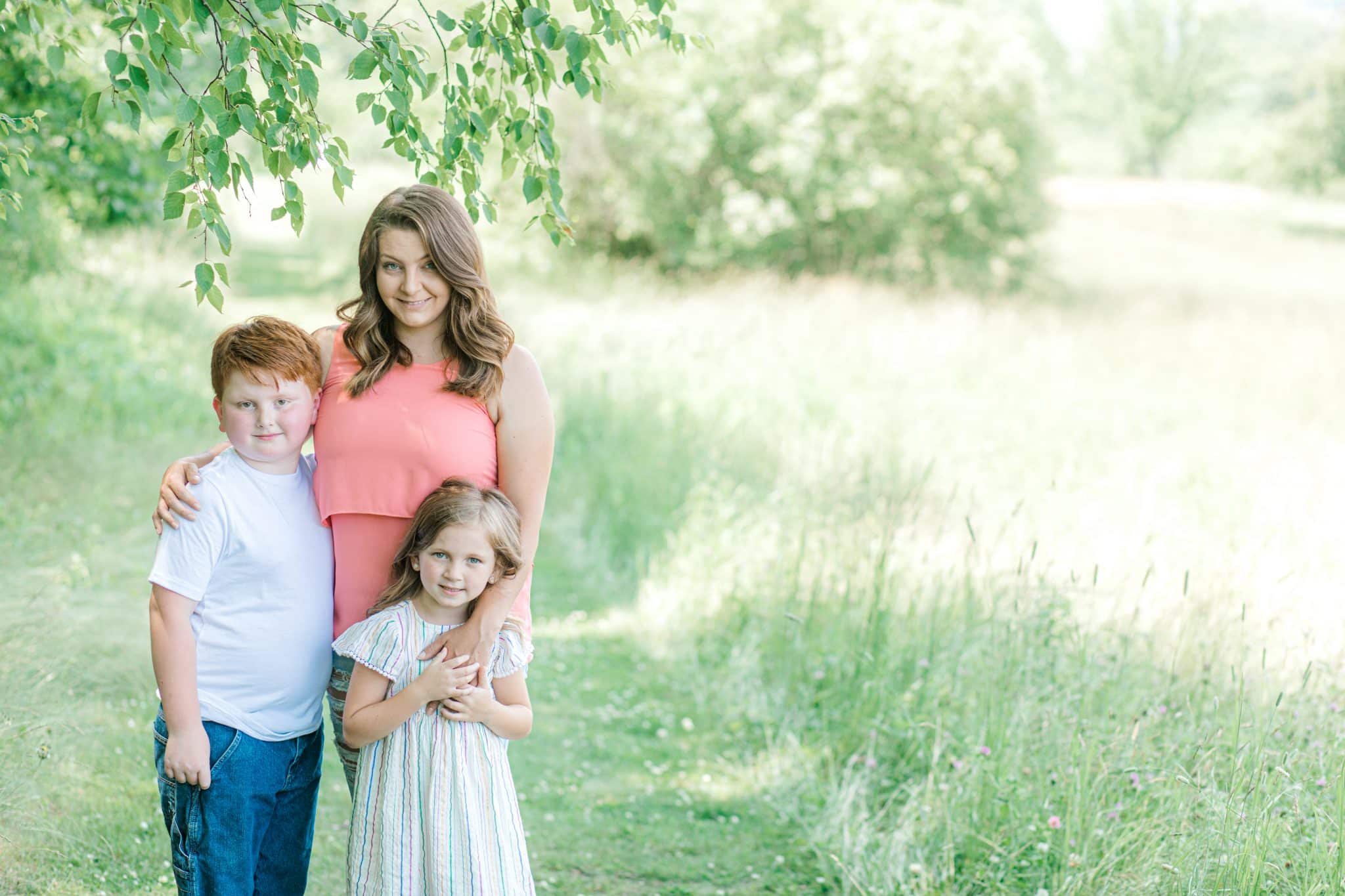 mother and two kids looking at the camera