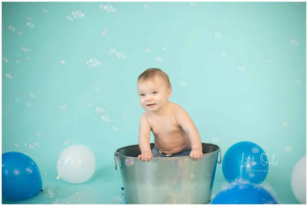 one year old boy in tub with bubbles