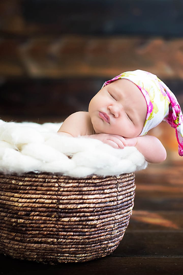 newborn in basket