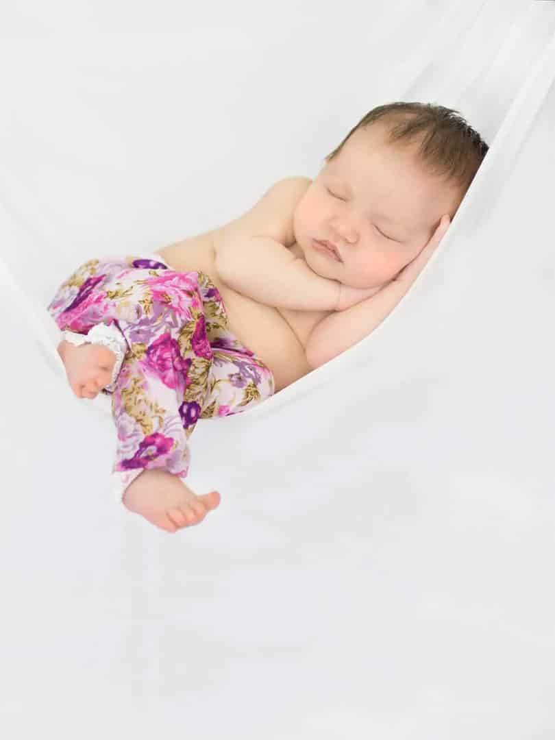 baby photographed sleeping in hammock