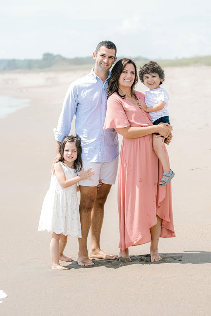 family photo taken on a maine beach