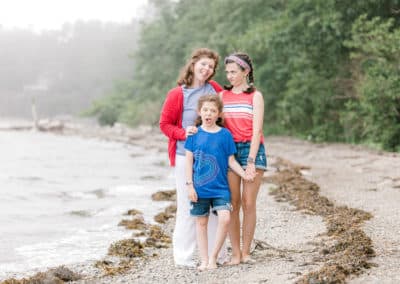 mother and daughters on maine beach