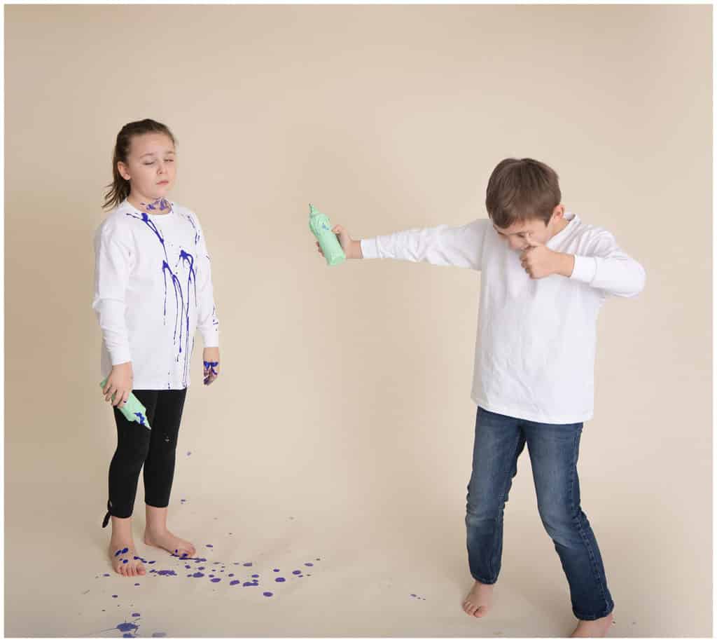 brother and sister in studio paint fight gender reveal, sister is mad it's a boy 