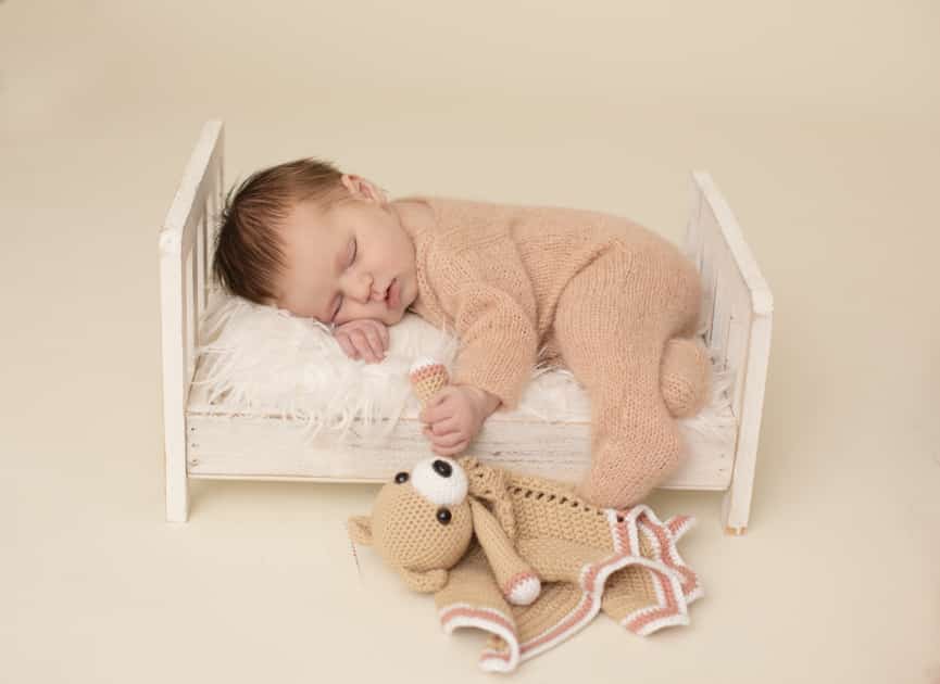  posed newborn girl in crib, augusta maine studio newborn