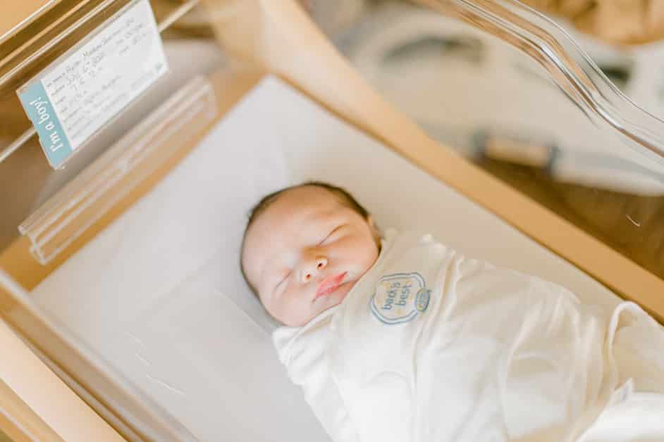 newborn boy in the basinet in the hospital 