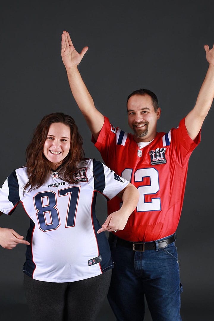 Maine maternity session Patriots fans wearing jerseys